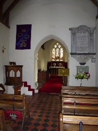 The aisle, altar and pulpit of All Saints Church.
