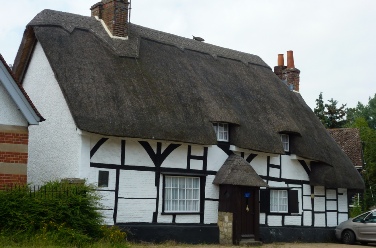 A thatched cottage on the High Street in Sutton Courtenay.  